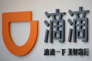 Сервис вызова водителя Didi купит Uber China